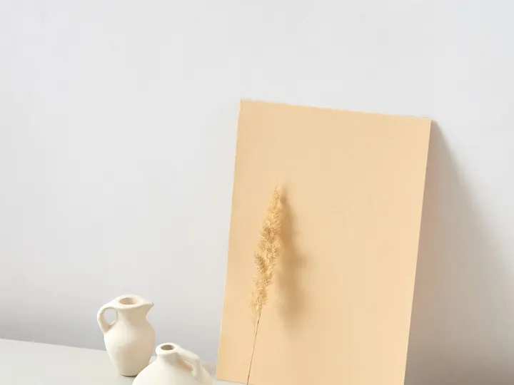 Ceramic vessels on a plinth in a white studio