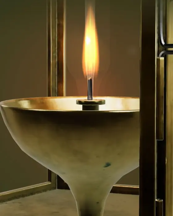 Close render of the lit wick in the bowl, seen through the glass frame.